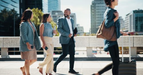 Colleagues walking and talking outside